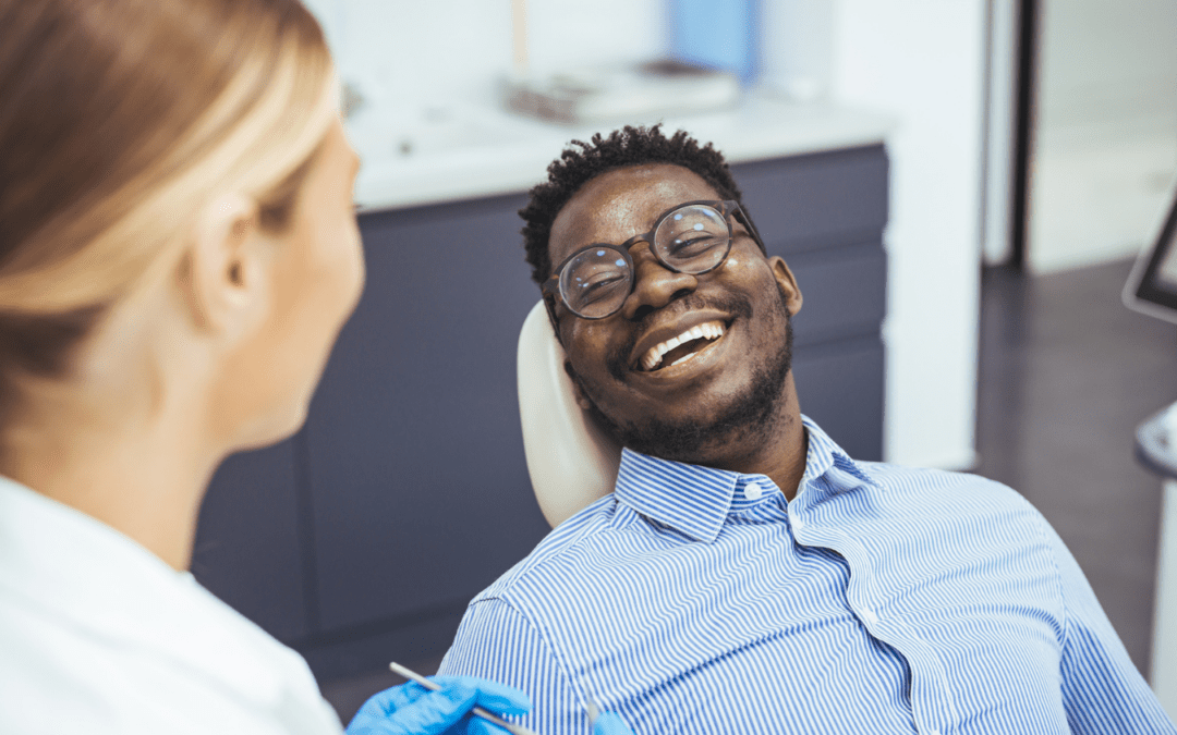 Patient smiling at dentist office.