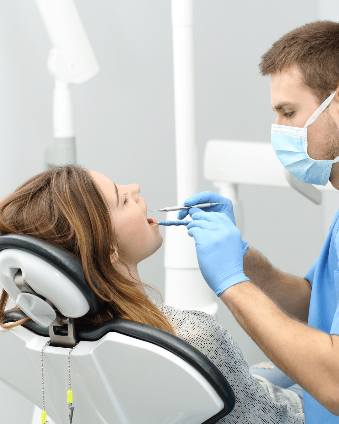 male dentist working on a female patient